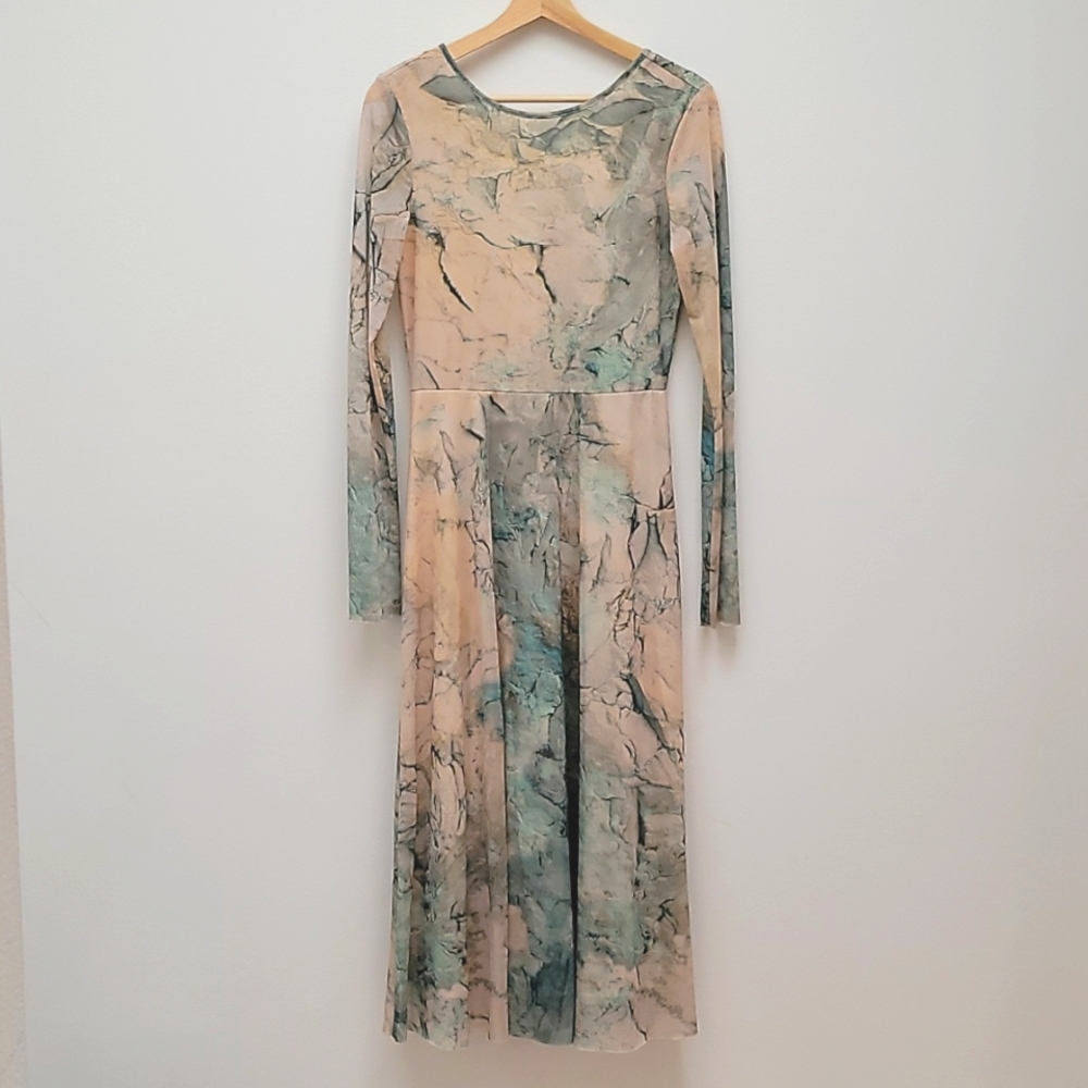 A mesh H&M dress with an open back